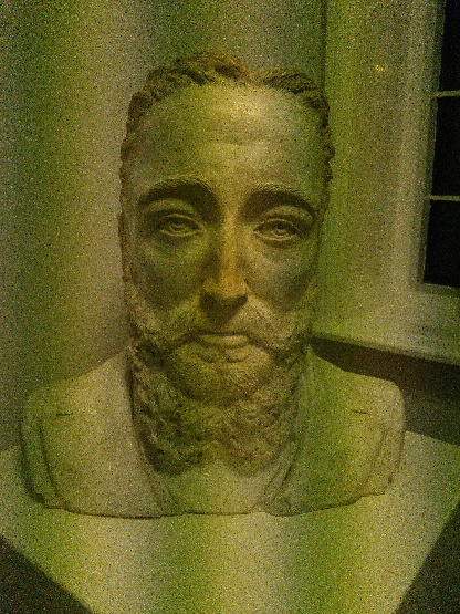 a bust of the author with weird striping along the image inconsistent with the lighting in the room